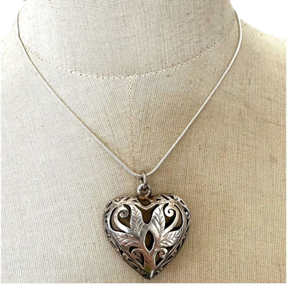 Silver tone puffy heart cut out pendant necklace